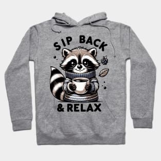 Cozy Critter Comfort: "Sip Back & Relax" Raccoon Design Hoodie